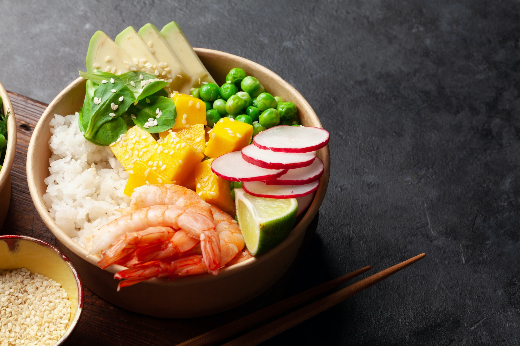 Poke bowl with shrimps, avocado and mango